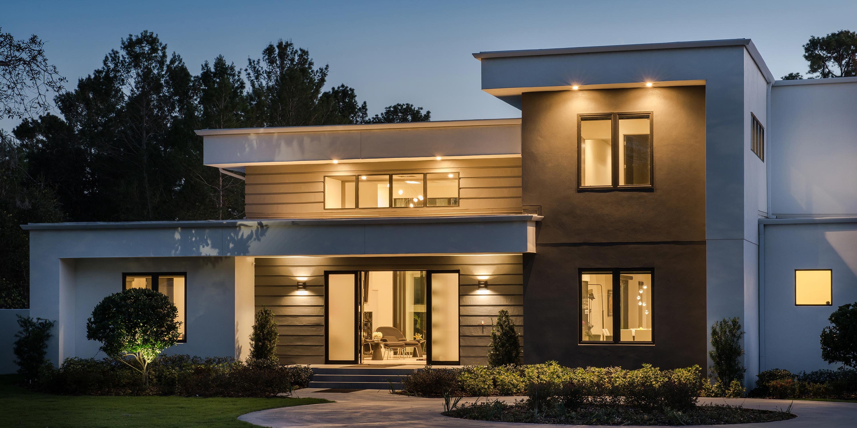 Outdoor view of a modern house with outdoor lighting