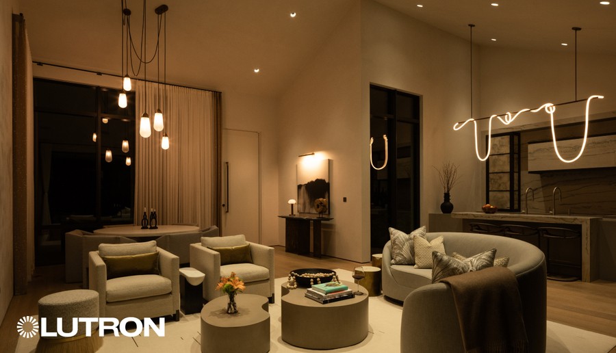 Softly illuminated living room and kitchen area.