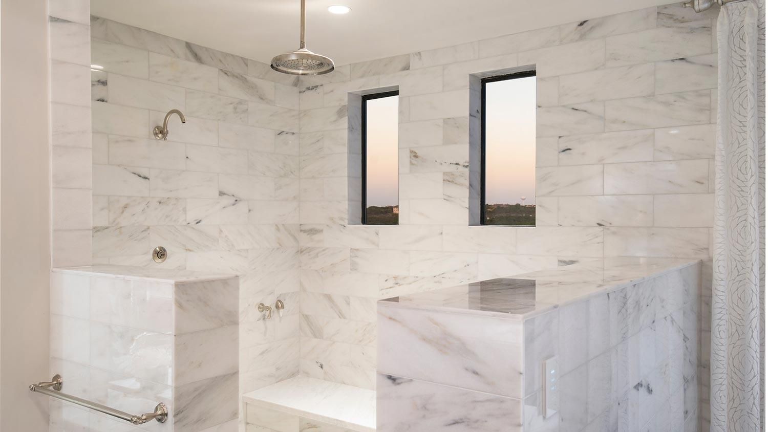 Ketra lighting in a white marbled bathroom
